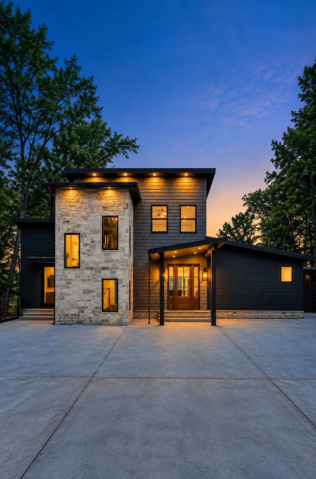Modern home photographed at twilight with warm interior lighting