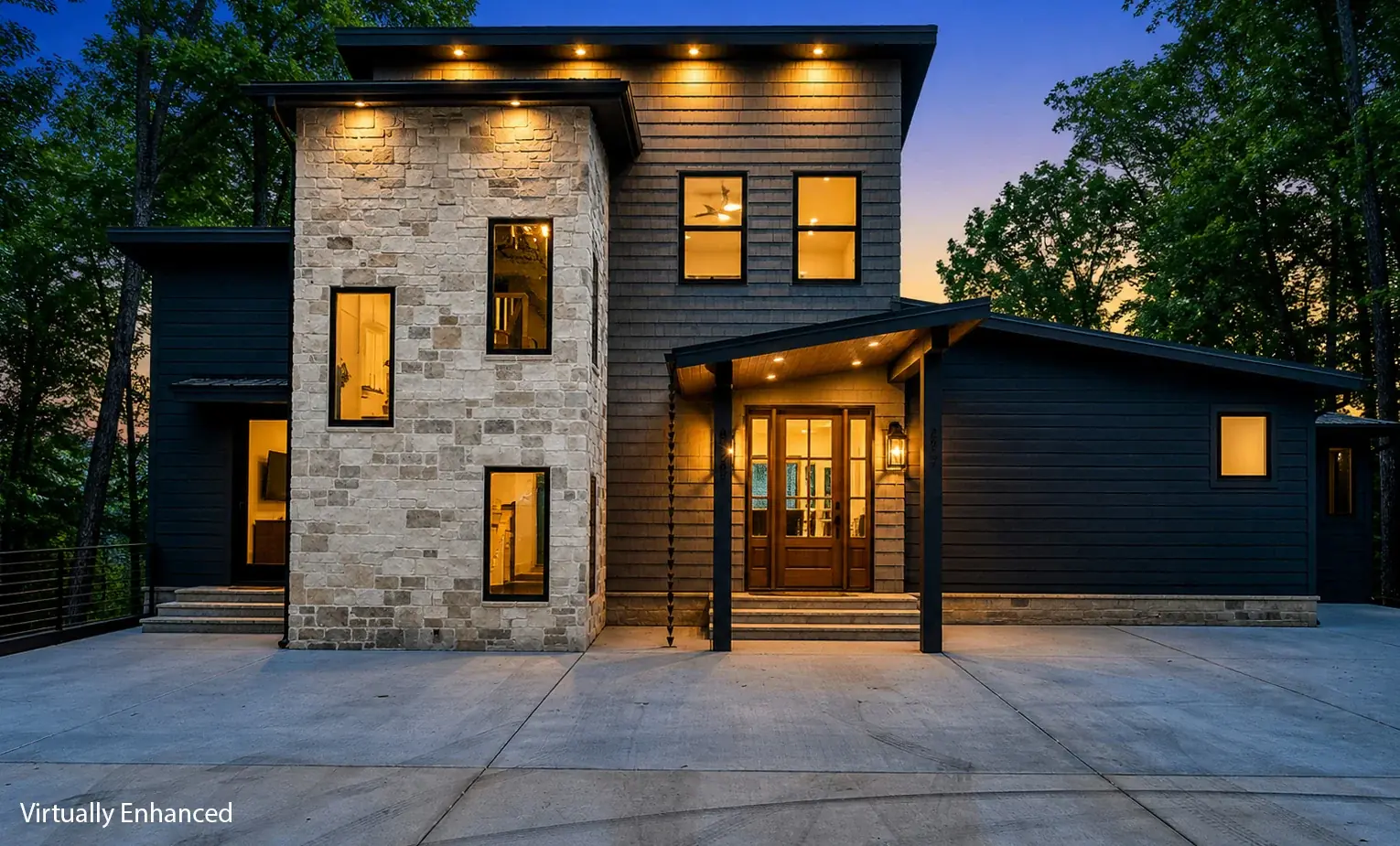 Modern home photographed at twilight with warm interior lighting