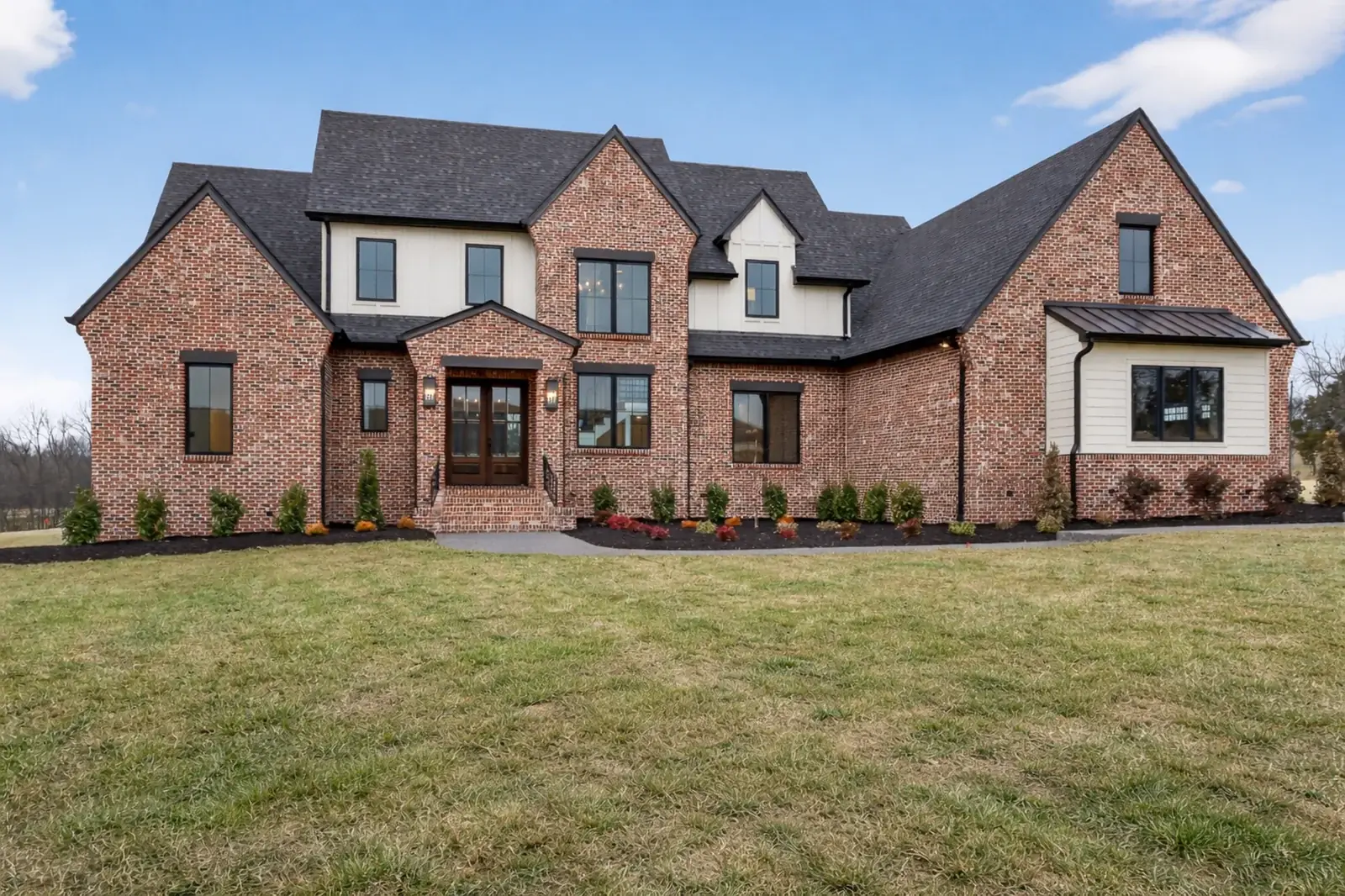 New construction brick and board-and-batten home front elevation