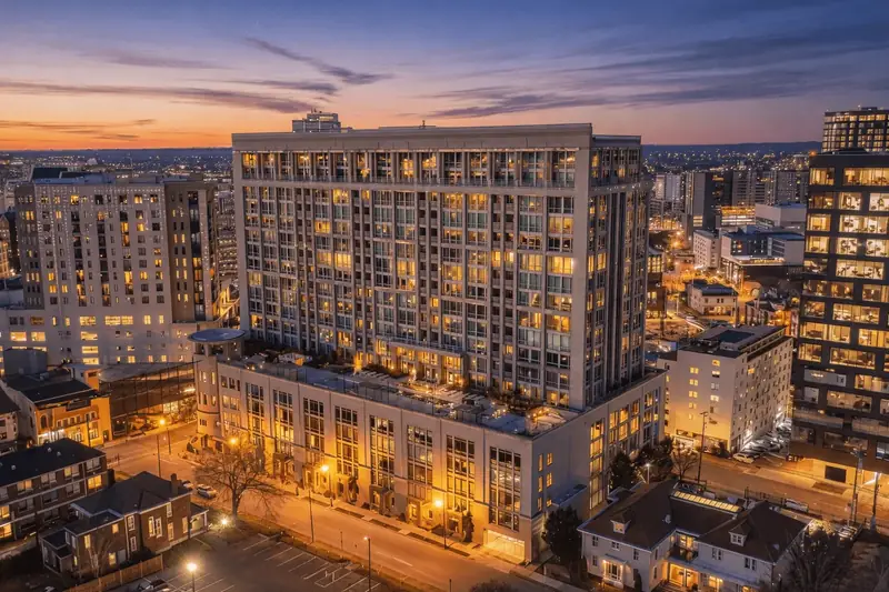 Aerial twilight view over a downtown residential tower