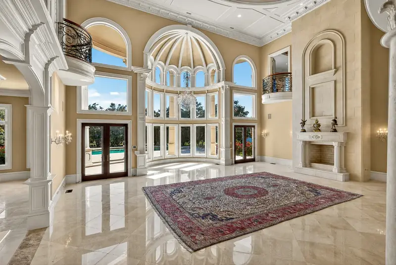 Two-storey great room with domed rotunda and chandelier
