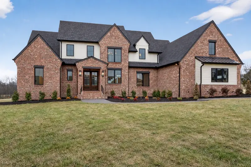 New construction brick and board-and-batten home front elevation